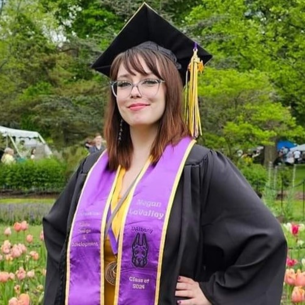 A photo of Megan from her graduation from UAlbany.